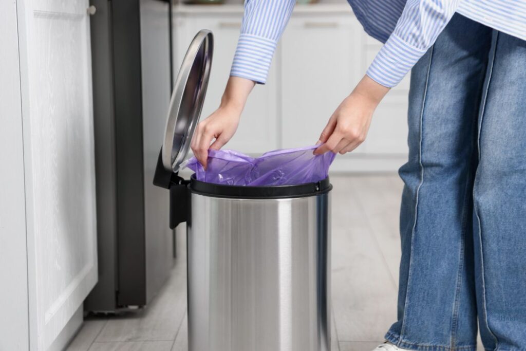 woman emptying trash